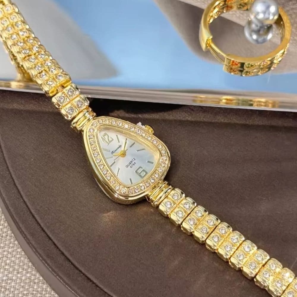 RELOJ OVAL DORADO CON BRILLOS