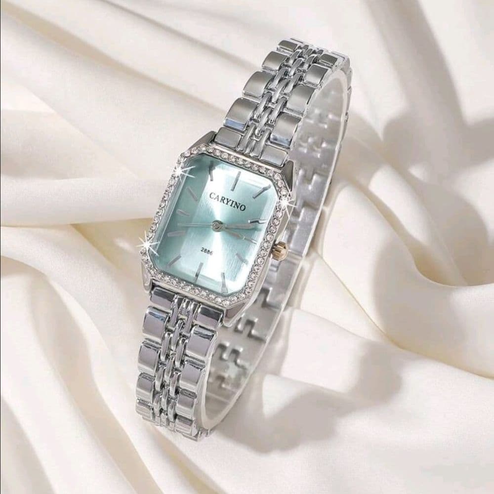 RELOJ CARYINO DE ACERO INOXIDABLE PLATEADO FONDO CELESTE