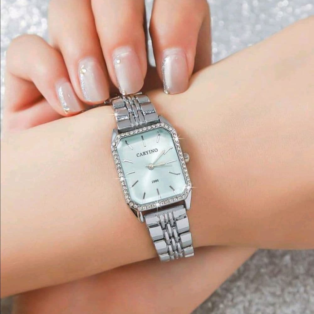RELOJ CARYINO DE ACERO INOXIDABLE PLATEADO FONDO CELESTE